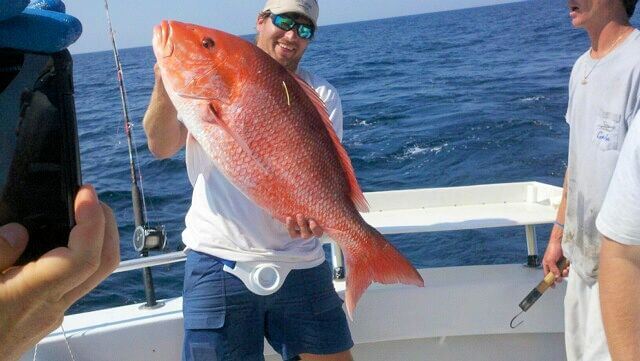 Giant Red Snapper Deep Sea Fishing off Pensacola Beach Florida caught on charter boat Total Package Charters - Pensacola Charter boat fishing